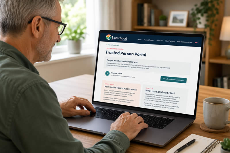 A man at a laptop logged into the Trusted Person portal